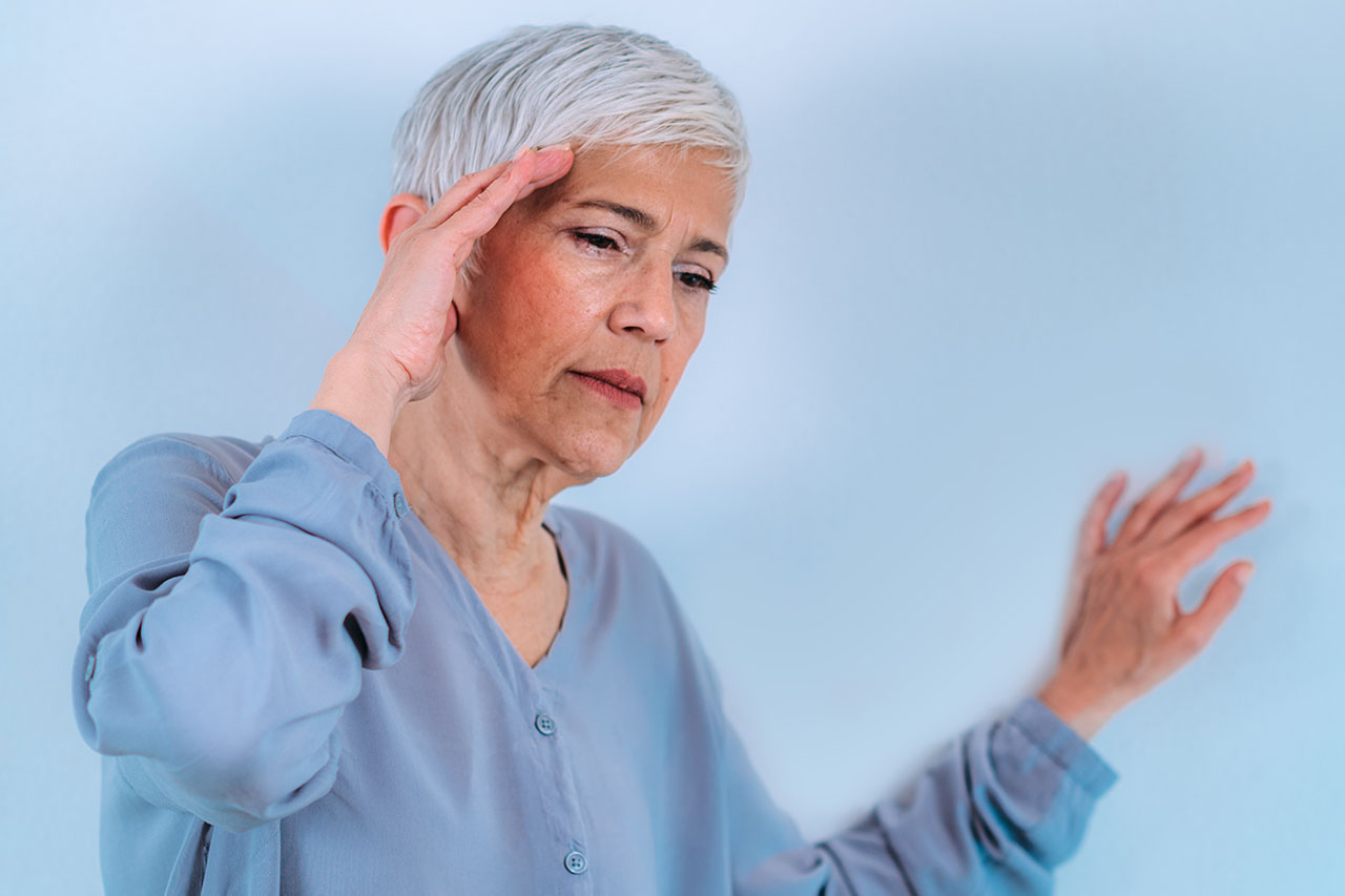 Los Angeles woman with her hand on her head showing symptoms of subclavian steal syndrome 