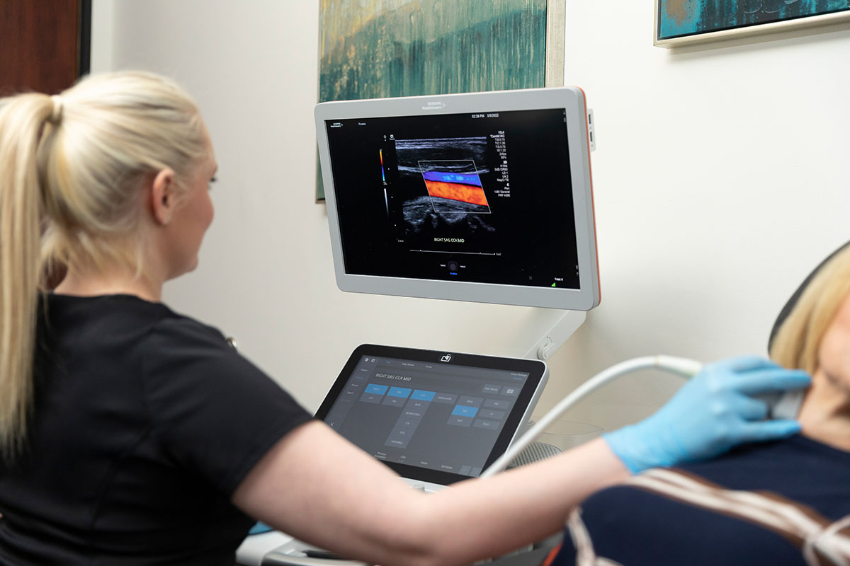 Kim Turner, a team member at SCMSC in Los Angeles, performs a carotid ultrasound on a patient experiencing symptoms of  carotid artery blockage