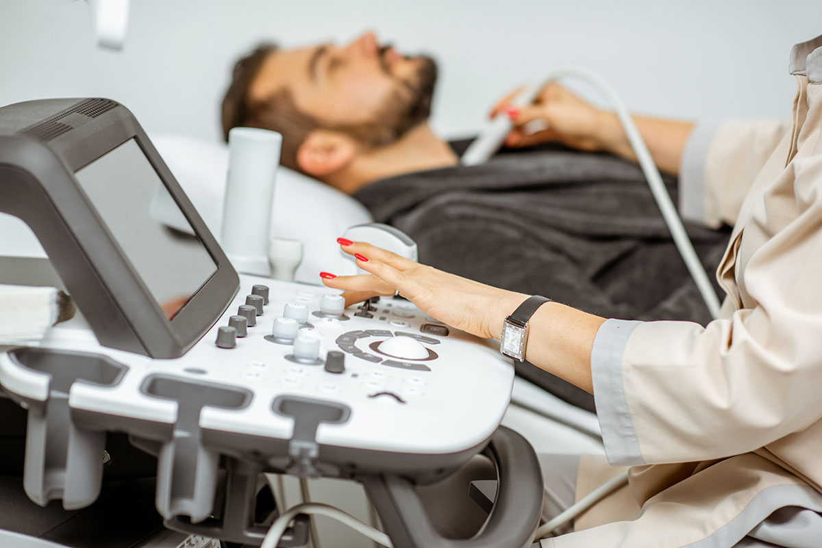 man having thyroid ultrasound at Southern California Multi-Specialty Center in Los Angeles