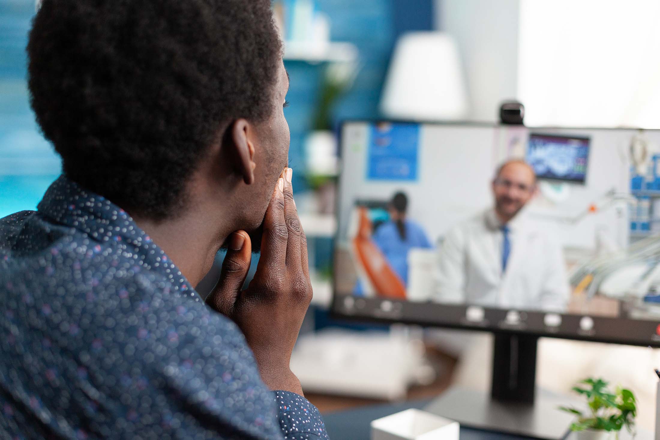 Man takes advantage of telehealth services to have a video consultation with his doctor