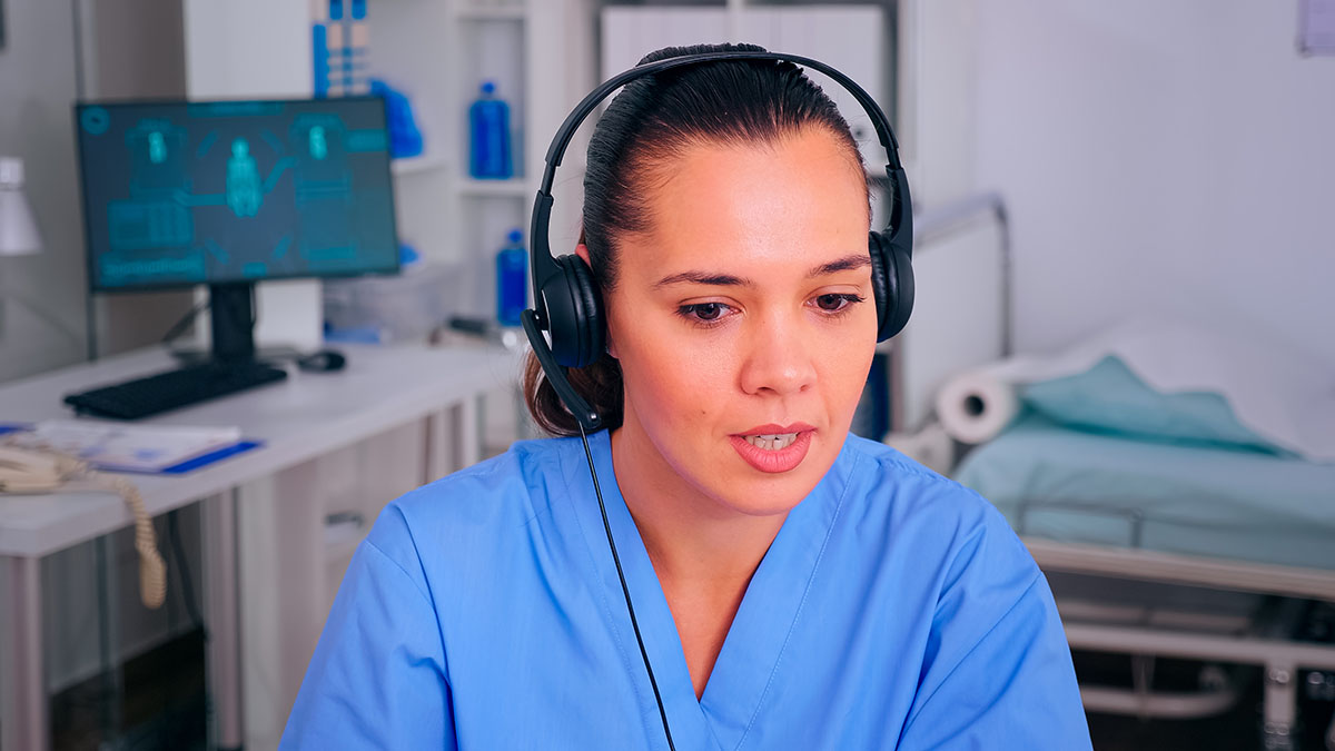 Specialist nurse answers a patient's questions about his prescription on a convenient video call