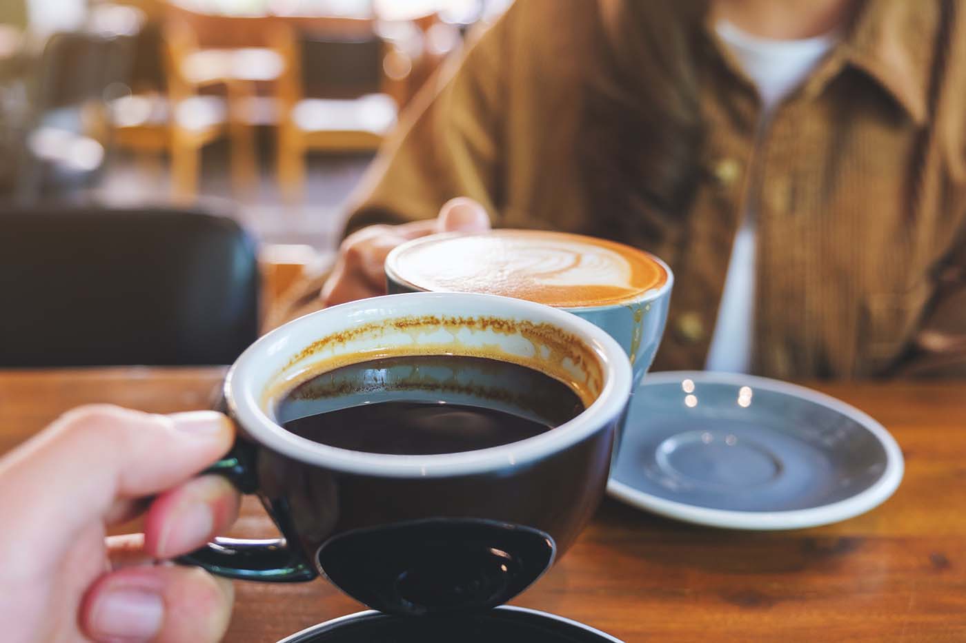 friends enjoying coffee at a coffee shop