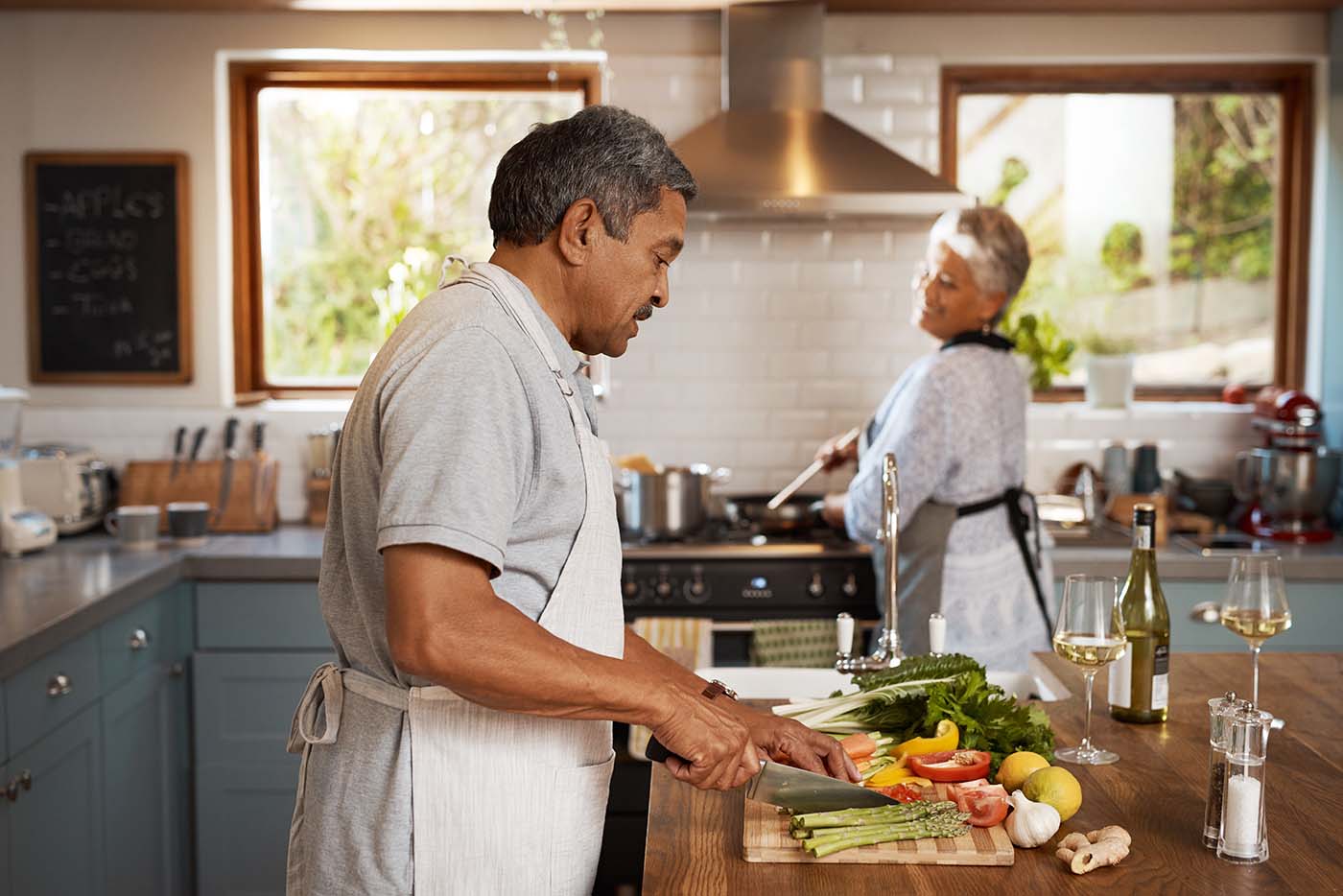 senior couple prepare a healthy meal in the kitchen